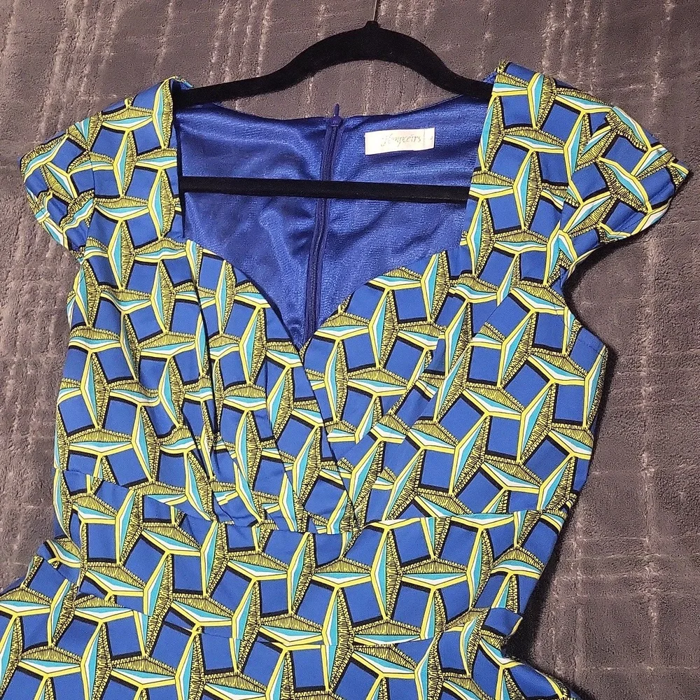 A patterned blue, turquoise, yellow & black dress. - Picture 4 of 5